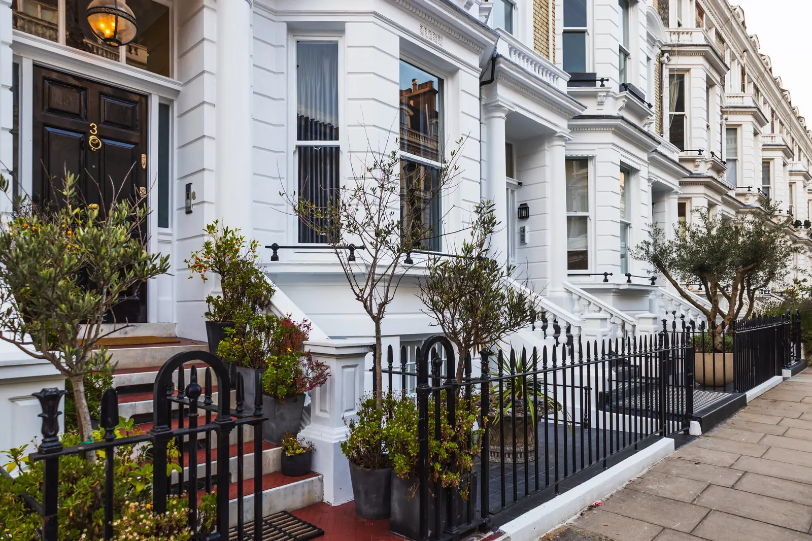 Luxury Kensington residential buildings with white stucco facades